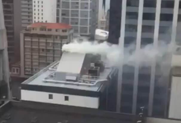 Smoke coming from a chimney near Sky Tower